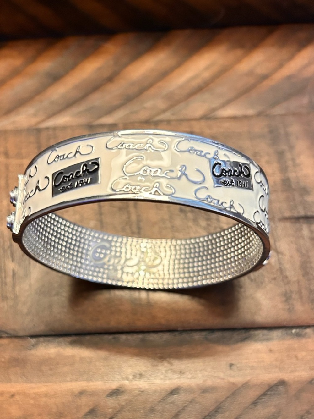 Coach Silver-Tone Signature Script Hinged Bangle